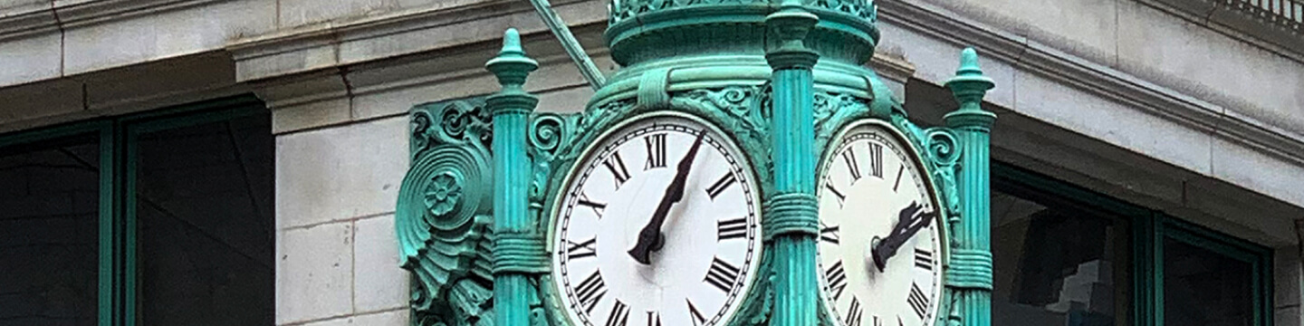 Antique clock on street corner